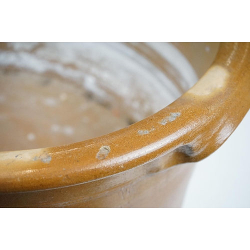 116 - Large 19th Century Victorian salt glazed Dairy Bowl of oval form with twin handles. Measures 23 x 54... 