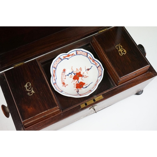 120 - 19th Century sarcophagus tea caddy being inlaid with mother of pearl floral sprays opening to reveal... 