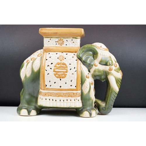 121 - Ceramic elephant jardinere stand / stool in the form of a Chinese elephant with green and yellow gla... 