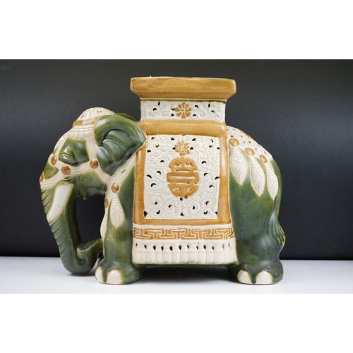 121 - Ceramic elephant jardinere stand / stool in the form of a Chinese elephant with green and yellow gla... 