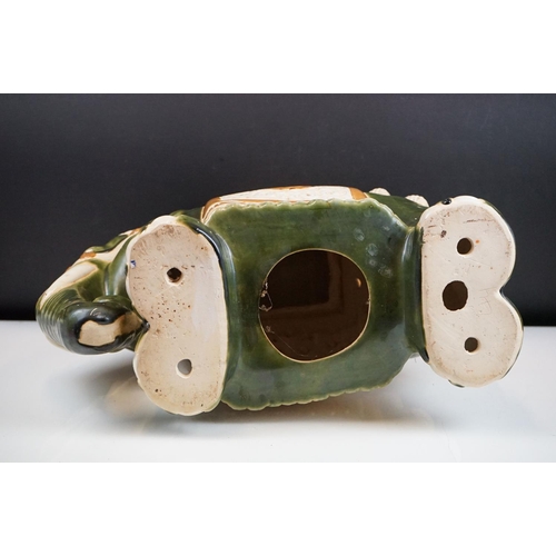 121 - Ceramic elephant jardinere stand / stool in the form of a Chinese elephant with green and yellow gla... 