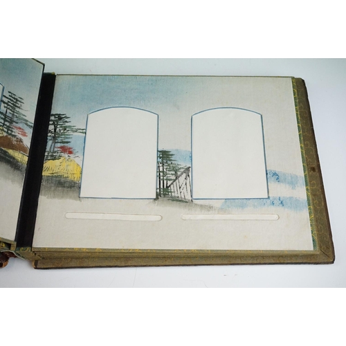 124 - Early 20th Century Japanese lacquer photograph / postcard album having applied mother of pearl figur... 