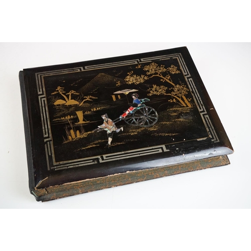 125 - Early 20th Century Japanese lacquer photograph / postcard album featuring a gilt landscape scene to ... 