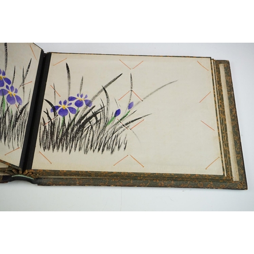 125 - Early 20th Century Japanese lacquer photograph / postcard album featuring a gilt landscape scene to ... 