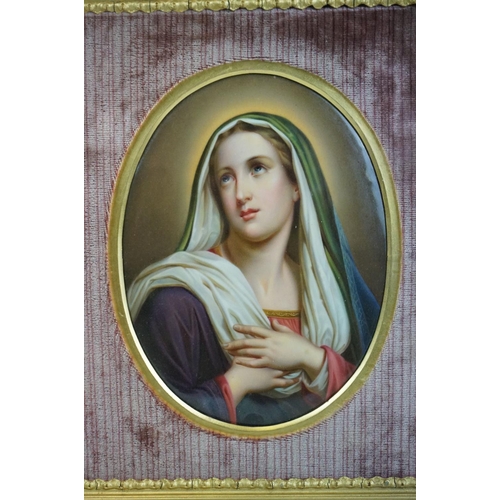 130 - Oval Porcelain Plaque in the Berlin style depicting the Madonna set within a velvet lined wooden fra... 