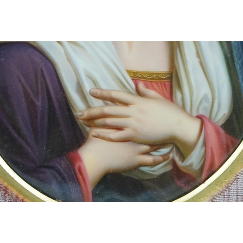 130 - Oval Porcelain Plaque in the Berlin style depicting the Madonna set within a velvet lined wooden fra... 