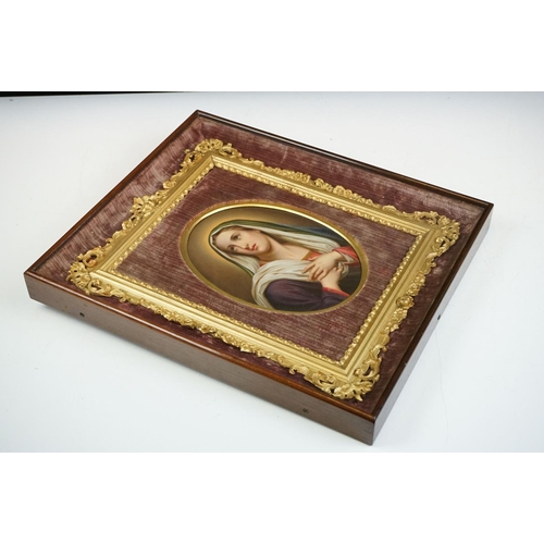 130 - Oval Porcelain Plaque in the Berlin style depicting the Madonna set within a velvet lined wooden fra... 