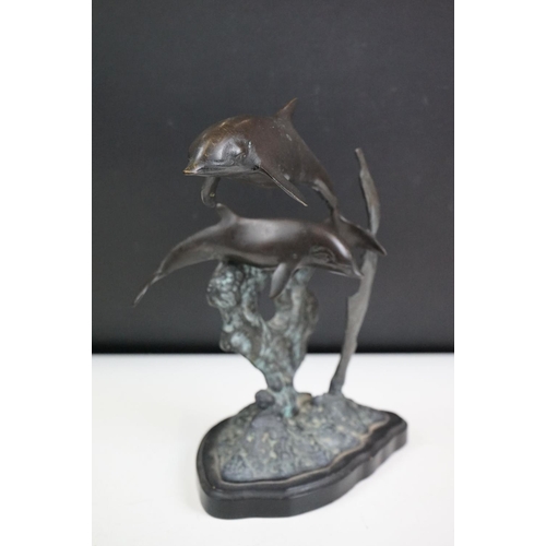 135 - An ornamental bronze of a Dolphin & Calf, stands approx 27cm in height.