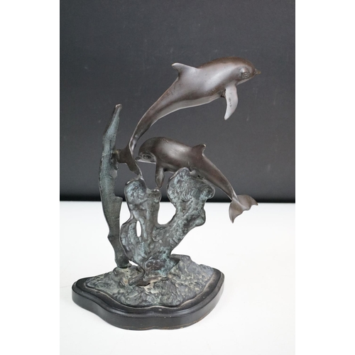 135 - An ornamental bronze of a Dolphin & Calf, stands approx 27cm in height.