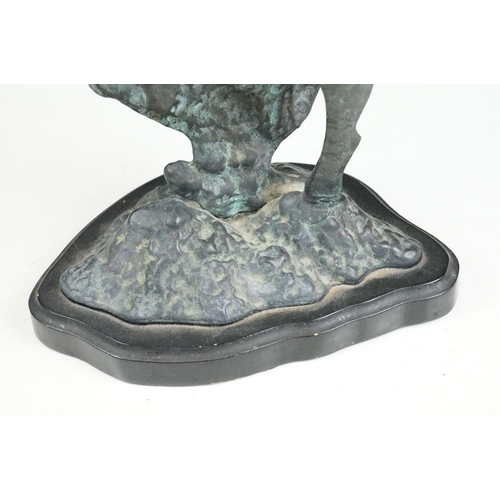 135 - An ornamental bronze of a Dolphin & Calf, stands approx 27cm in height.