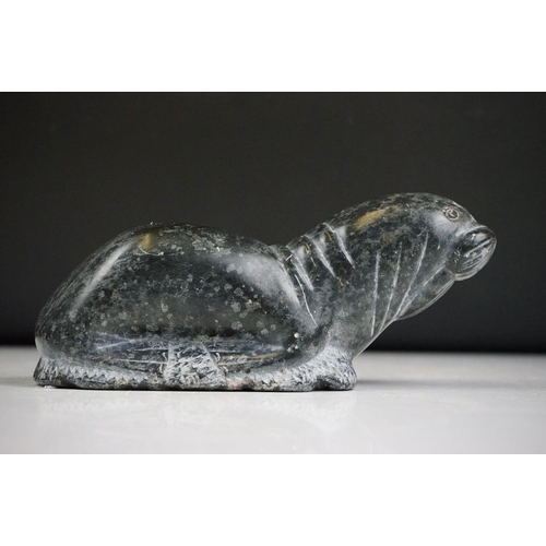 142 - A Canadian Inuit / Eskimo art carved soapstone ornamental seal together with a frog.