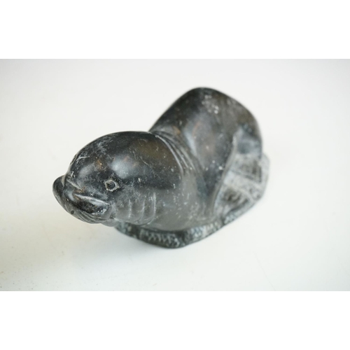 142 - A Canadian Inuit / Eskimo art carved soapstone ornamental seal together with a frog.