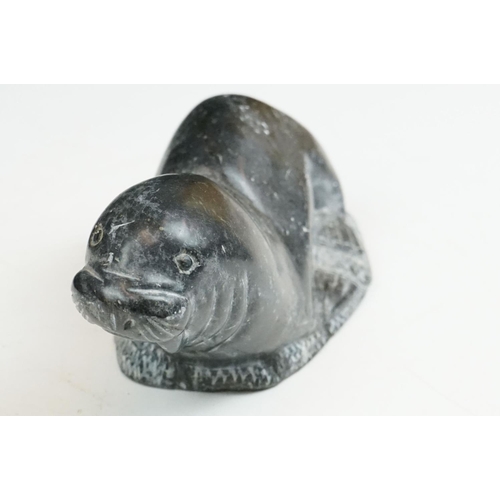 142 - A Canadian Inuit / Eskimo art carved soapstone ornamental seal together with a frog.