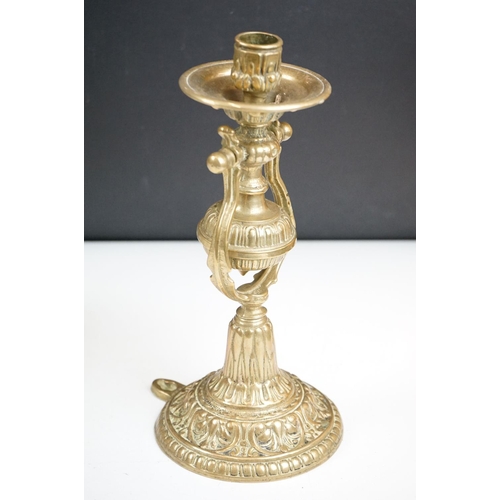 144 - A pair of brass standing or wall mounted candlesticks with gimble mounting.