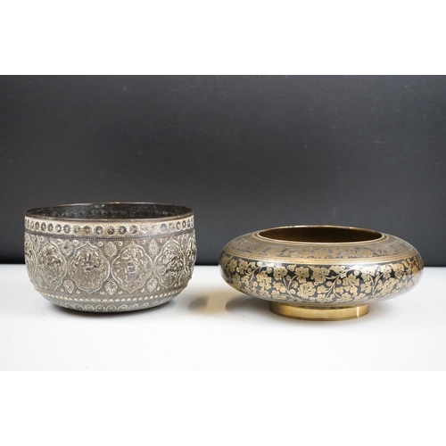 148 - An antique asian copper bowl with silvered relief decoration together with a brass example.