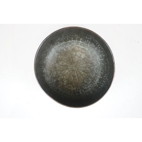 148 - An antique asian copper bowl with silvered relief decoration together with a brass example.