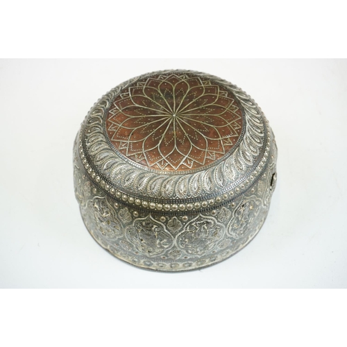 148 - An antique asian copper bowl with silvered relief decoration together with a brass example.