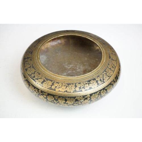 148 - An antique asian copper bowl with silvered relief decoration together with a brass example.