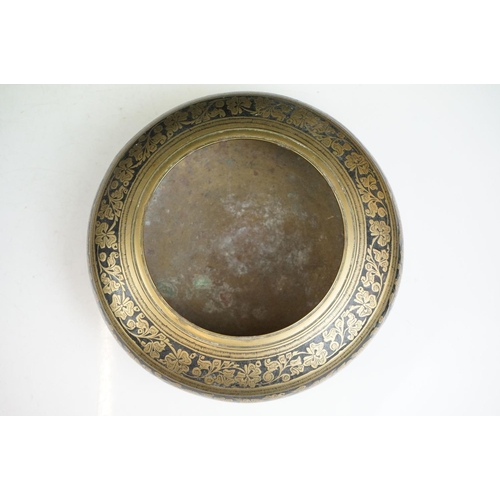 148 - An antique asian copper bowl with silvered relief decoration together with a brass example.