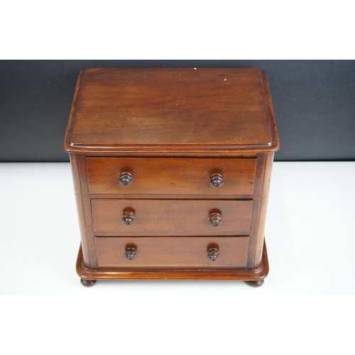 151 - Victorian mahogany table top three drawer chest