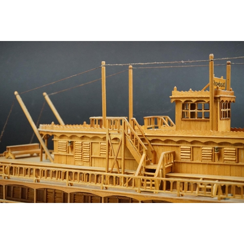 155 - A kit built wooden model of the Showboat paddle steamer, measures approx 80cm in length.