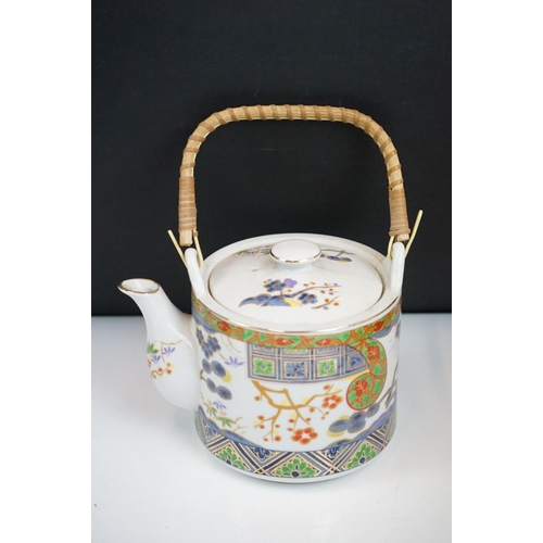 90 - 20th Century Japanese tea set having printed decoration to the sides including tea pot and six cups,... 