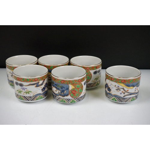 90 - 20th Century Japanese tea set having printed decoration to the sides including tea pot and six cups,... 