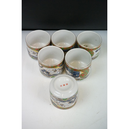 90 - 20th Century Japanese tea set having printed decoration to the sides including tea pot and six cups,... 