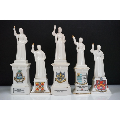 91 - 40 ceramic crested ware / goss figurines of Florence Nightingale, each with a town crest to the fron... 