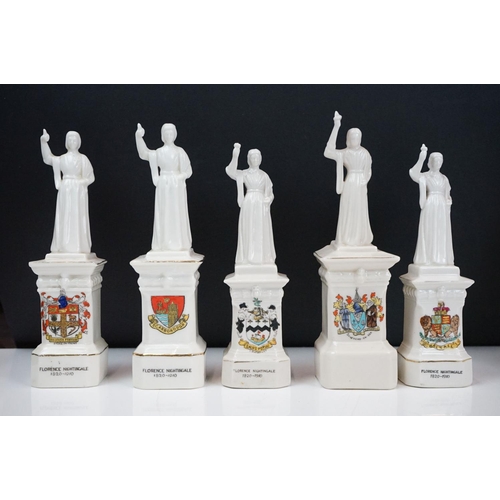 91 - 40 ceramic crested ware / goss figurines of Florence Nightingale, each with a town crest to the fron... 