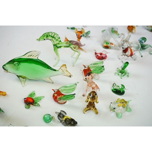 92 - Assorted 20th Century glassware to include Murano animals and an assortment of glass paperweights (a... 