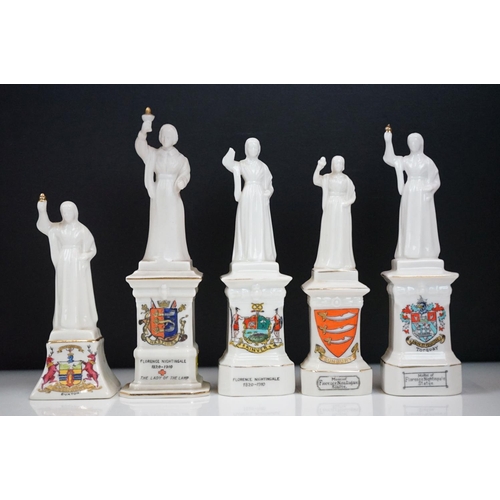 94 - 35 ceramic crested ware / goss figurines of Florence Nightingale, each with a town crest to the fron... 