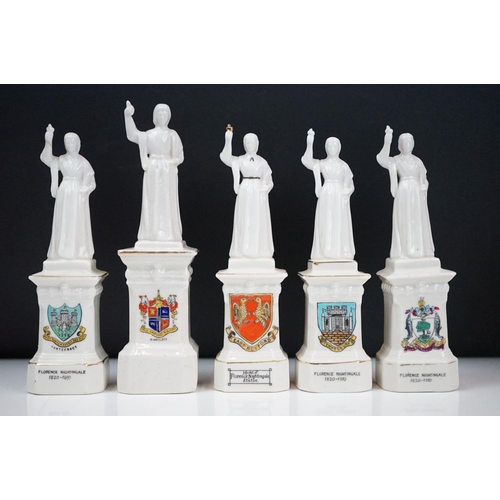 94 - 35 ceramic crested ware / goss figurines of Florence Nightingale, each with a town crest to the fron... 