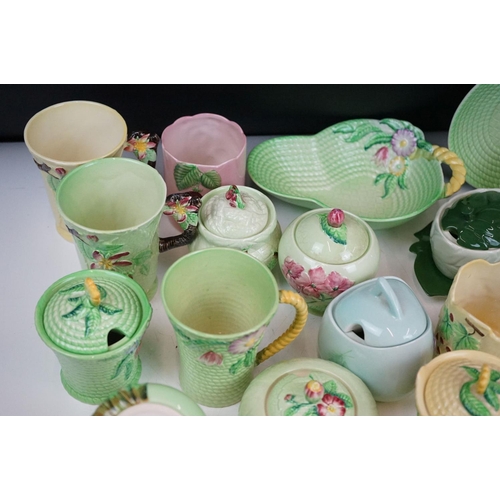 95 - Carlton Ware - Collection of Art Deco ceramics to include lidded sugar bowls, four mugs, side plate ... 