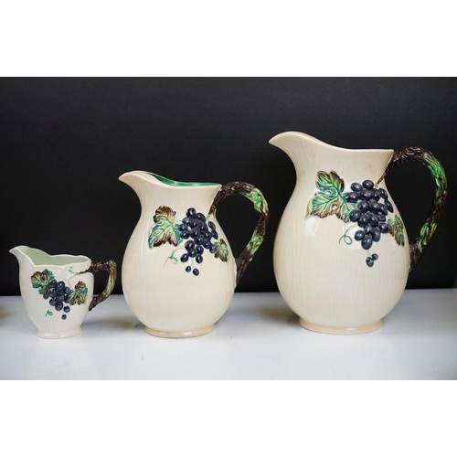 97 - Carlton Ware - 1930's Grape pattern ceramics to include three jugs, Hors d'oeuvre platters, mugs, to... 