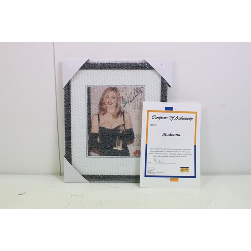 444 - Madonna autograph - a signed photograph of Madonna at the Golden Globe awards with certificate of au... 