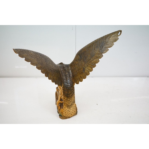 170 - Carved wooden eagle statue carved with out stretched wings with painted detailing raised on a wooden... 