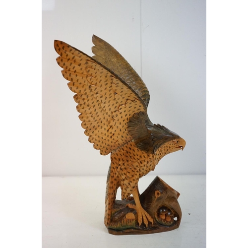 170 - Carved wooden eagle statue carved with out stretched wings with painted detailing raised on a wooden... 