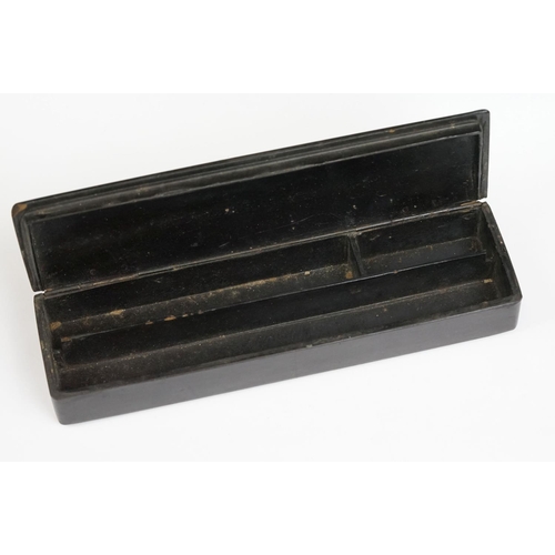 175 - Japanese Black Lacquered Pen Box, the hinged lid with gilt chinoiserie decoration opening to two pen... 