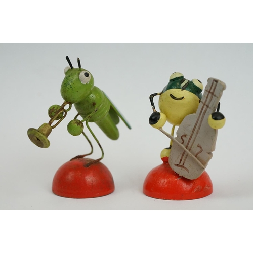 193 - A collection of wooden Erzebirge toy band figures in the form of insects.