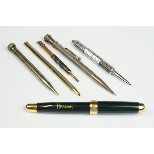 199 - A small collection of mixed pens to include Harrods and Sterling silver examples.