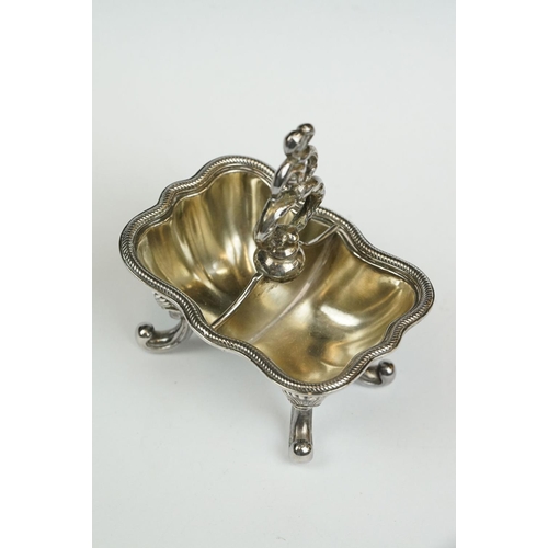 200 - A set of four Italian silver boat shaped salt cellars, on scroll feet.