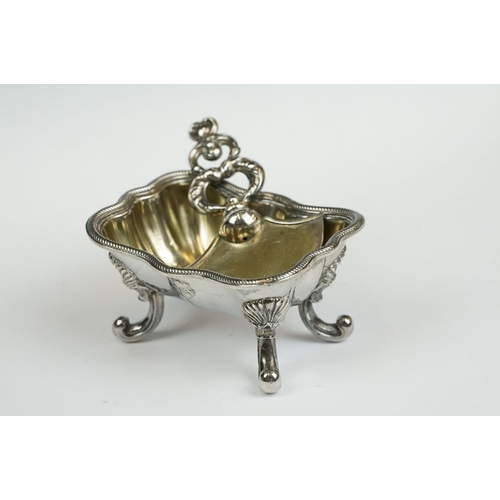 200 - A set of four Italian silver boat shaped salt cellars, on scroll feet.