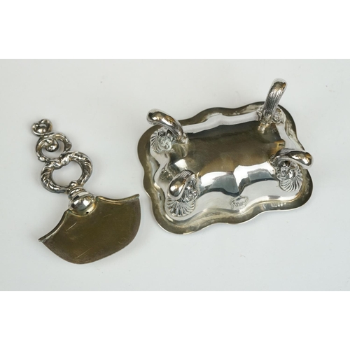 200 - A set of four Italian silver boat shaped salt cellars, on scroll feet.