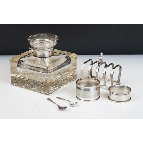 201A - An early 20th century cut glass inkwell with sterling silver top together with a sterling silver toa... 