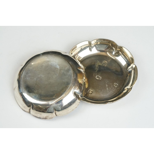 205 - Pair of silver ashtrays