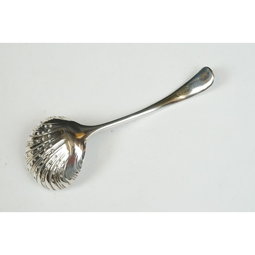 208 - Three silver sugar tongs, a millennium cheese scoop and other spoons