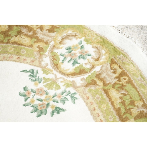 597 - Cream and Green Ground Circular Rug with floral pattern, approx. 185cm diameter