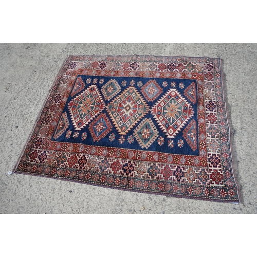 598 - Eastern Red and Blue Ground Wool Rug decorated with six guls within a deep border, approx. 151cm x 1... 