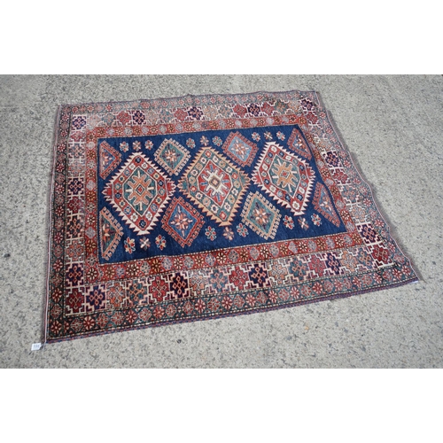 598 - Eastern Red and Blue Ground Wool Rug decorated with six guls within a deep border, approx. 151cm x 1... 